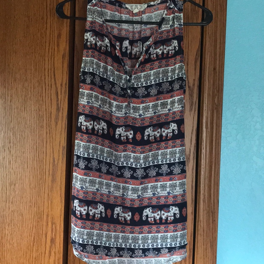 Tank top with elephants.